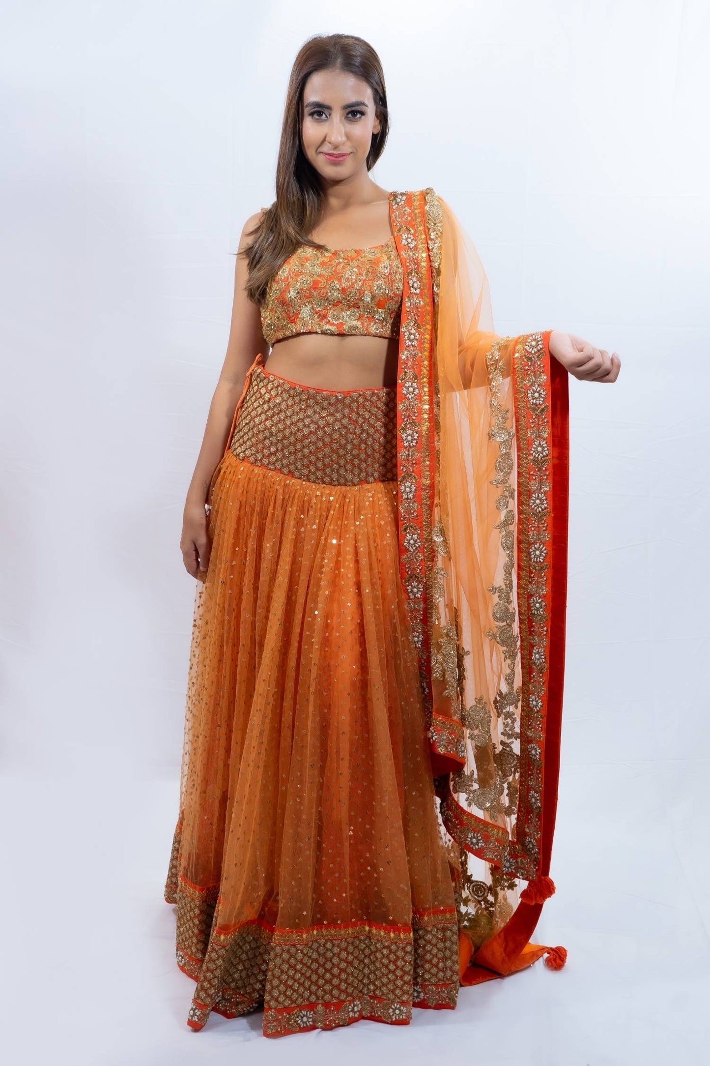 Orange and gold detail lengha Indian outfit rental in Bangkok